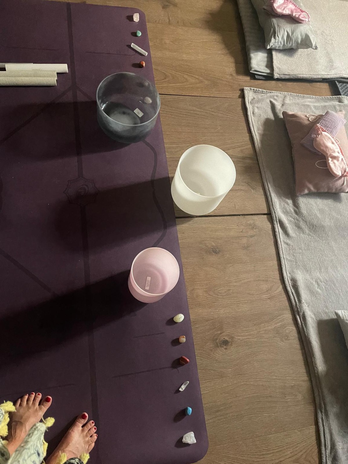 Crystal bowls arranged on a purple mat