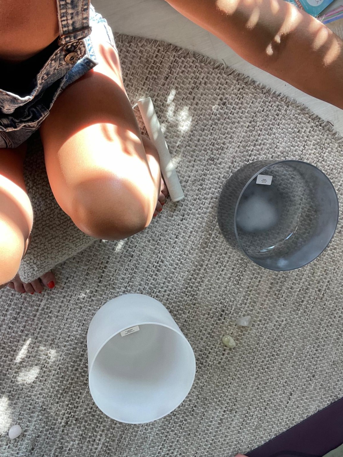 Playing a crystal sound bowl during a session
