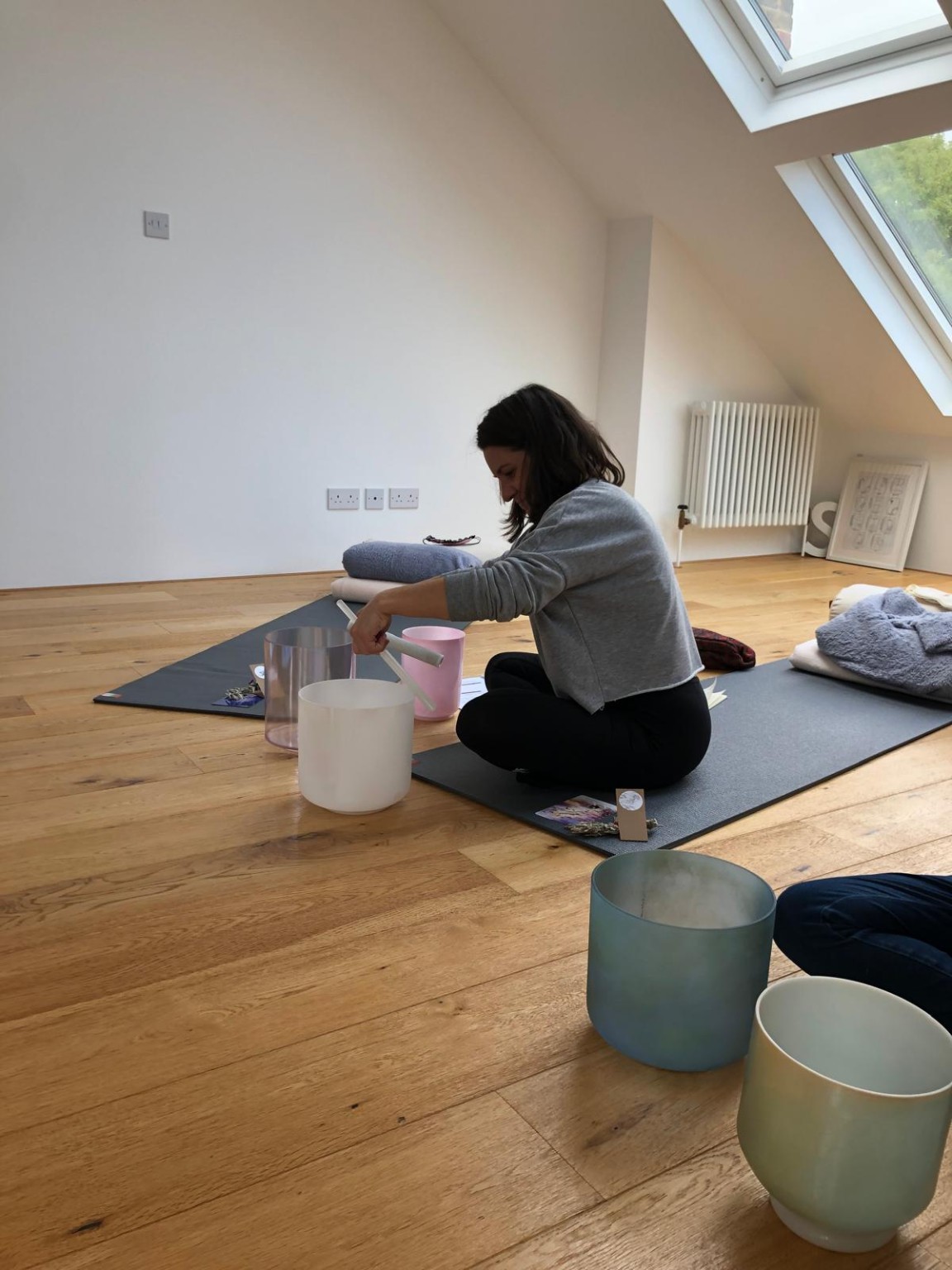 Practising with crystal sound bowls during my Level 2 sound healing training