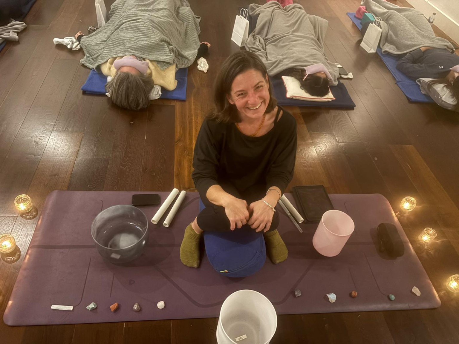 Me beside my sound bowls during a sound bath session